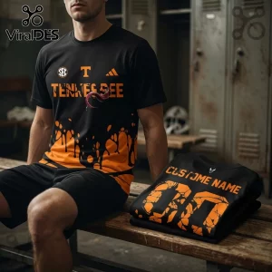 Tennessee Volunteers themed black and orange athletic t-shirt with paint drip pattern and custom name jersey text.!