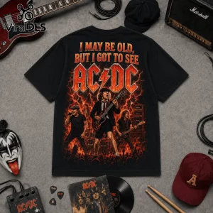 Vintage AC/DC I May Be Old Band T-Shirt featuring Angus Young graphic, band members, and lightning on a black cotton tee.