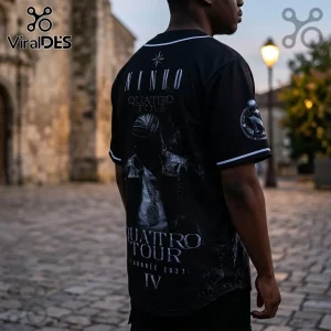 Black baseball jersey with Ninho Quattro Tour 2027 graphic, featuring a male figure in leather jacket on the back.!