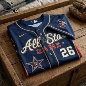 Navy blue baseball jersey with gold trim featuring 2022 Atlanta All-Star Game patch and number 26 on wooden surface.!