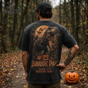 Jurassic Park Halloween T-Rex Pumpkin Black Cotton T-Shirt with graphic print of a dinosaur and full moon on the back.
