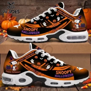 Snoopy Halloween sneakers with black and orange pumpkin, ghost, and witch graphics on a wooden background.!