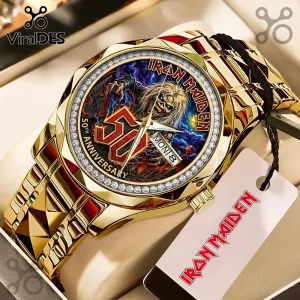 Gold Iron Maiden 50th anniversary wristwatch featuring Eddie graphic on dial, crystal bezel, and matching metal tag.!