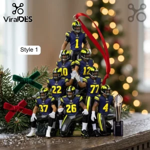 Michigan Wolverines football player pyramid ornament with a red ribbon and a championship trophy on a wooden base.!