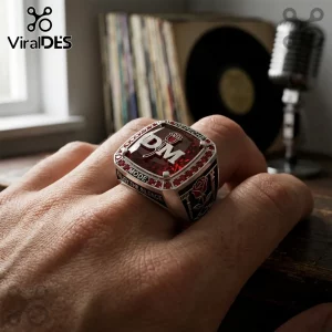 Silver championship-style ring featuring a red stone, DM logo, rose emblem, and Enjoy The Silence text on a hand.!