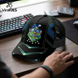 Sonic the Hedgehog 35th Anniversary trucker cap in black with blue and green accents on a desk near a computer keyboard.!