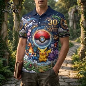Pokémon 30th anniversary navy blue polo shirt with printed graphics of Pikachu, Charizard, Mewtwo, and a central Poké Ball.!