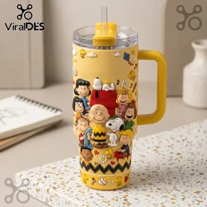 Yellow Peanuts tumbler with 3D embossed characters including Charlie Brown, Snoopy, and the gang, clear lid and straw.!