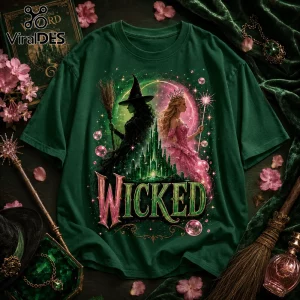 Forest green cotton t-shirt featuring Elphaba and Glinda, the Emerald City, and the word Wicked in metallic typography.!