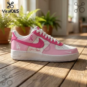 Custom Los Angeles Dodgers sneaker in pink and white with breast cancer ribbon emblem and Your Name text on wooden floor.!