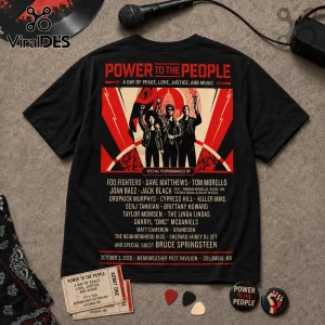 Black t-shirt featuring Power to the People concert graphic with red, cream, and black text detailing musical performers.!