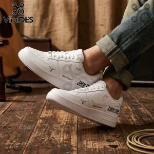 Custom white leather sneakers featuring a bull skull graphic, Zach Top text, and personal name print on wooden floor.!