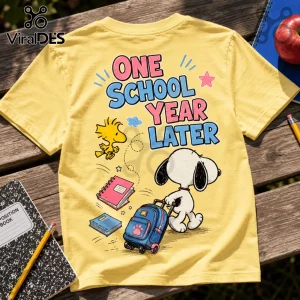 Yellow t-shirt with Snoopy pulling a rolling backpack and Woodstock, featuring the text One School Year Later.!