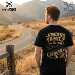 Man wearing a black cotton t-shirt with gold vintage text reading Finding Family on the road Alex Warren 26 Tour.!