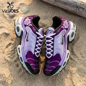 Selena-themed purple gradient Nike sneakers featuring rose embroidery and white laces on a sandy beach surface.!