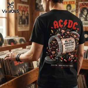 AC/DC Antidepressant Rock Band T-Shirt 2026 worn by a man in a record store, featuring a cartoon pill bottle graphic.