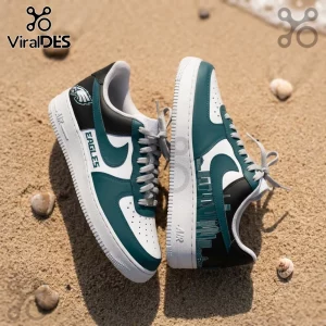 Philadelphia Eagles Skyline Custom Air Force 1 Sneakers in midnight green, black, and white on a sandy beach background.