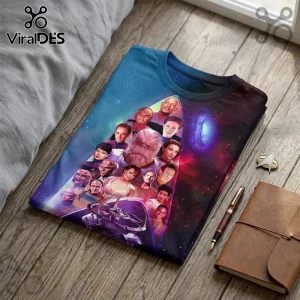 Star Trek Deep Space Nine ensemble graphic t-shirt on a wood surface with a Starfleet badge pin and leather notebook.!
