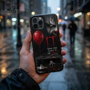 iPhone case featuring Pennywise the clown, a red balloon, a paper boat, and the text Every fear floats to the surface.!