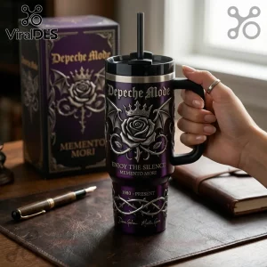 Depeche Mode Enjoy The Silence purple handle tumbler featuring a rose, bat wings, and Memento Mori text on a desk.