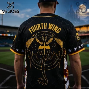 Black baseball jersey with gold Fourth Wing text and dragon graphic on back, worn by a man at a baseball stadium.!