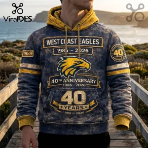 West Coast Eagles 40th anniversary navy hoodie with yellow eagle logo, 1986-2026 text, and distressed texture finish.!