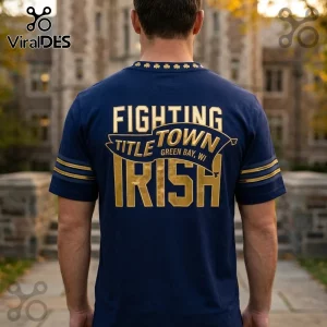 Navy blue cotton t-shirt with gold lettering reading Fighting Title Town Green Bay, WI, Irish, and shamrock collar trim.!