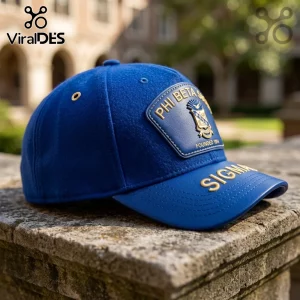 Royal blue baseball cap with a leather patch featuring the Phi Beta Sigma crest and gold Sigma lettering on the visor.!