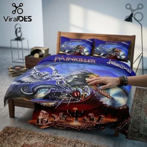 Judas Priest Painkiller album cover art printed on a blue and red bed comforter and pillowcases in a bedroom setting.!