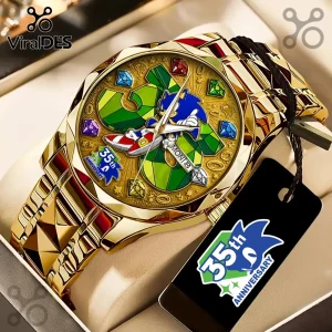 Gold-toned Sonic the Hedgehog 35th anniversary wristwatch with a multi-colored graphic dial and matching black hang tag.!