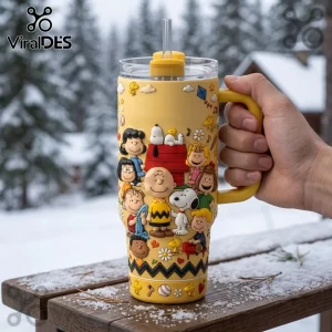 Yellow insulated tumbler featuring raised Peanuts character graphics including Charlie Brown, Snoopy, and Woodstock.!