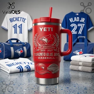 Red Yeti Rambler tumbler with 50th Anniversary Toronto Blue Jays logo, baseball cap, stadium graphic, and straw on counter.!