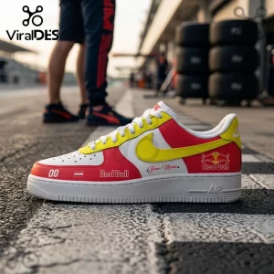 Custom Red Bull Racing Nike Air Force 1 Sneakers featuring red, white, and yellow panels with team branding on a racetrack.