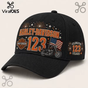 Harley-Davidson 123 Years Celebration black baseball cap with orange motorcycle graphic, American flag, and fireworks.