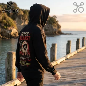 Person wearing black hooded sweatshirt with Rise Against Chicago Australia and New Zealand 2026 graphic on back.!