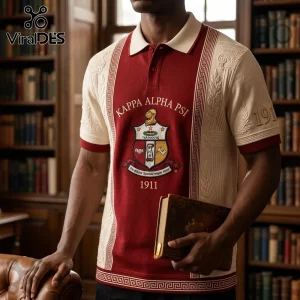 Kappa Alpha Psi crimson and cream knit polo shirt with embroidered crest and 1911 text against a library background.!