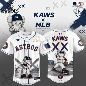 Houston Astros baseball jersey featuring KAWS character artwork, blue and orange graphics, and XX branding on white fabric.!