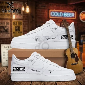 Custom white low-top sneakers featuring Zach Top text, a longhorn skull icon, and personalized name space on a bar background.!