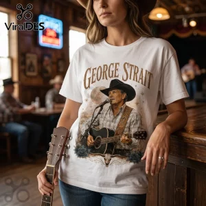 White cotton t-shirt with a vintage graphic of country singer George Strait holding an acoustic guitar and cowboy hat.!