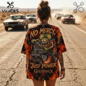 Black and orange tie-dye graphic t-shirt featuring a green cartoon rodent driving a hot rod with text No Mercy Godsmack.!