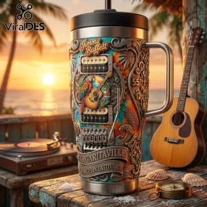 Jimmy Buffett Tie Dye YETI Handle Tumbler featuring a guitar, tropical sunset scene, and Margaritaville branding.