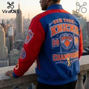 Person wearing a blue and red wool New York Knicks varsity jacket with team logos and NYC skyline print on the back.!