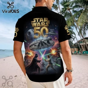 Black short-sleeve shirt featuring Star Wars 50th anniversary graphics, Darth Vader, Luke Skywalker, and the Millennium Falcon.!