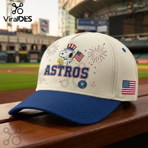 Houston Astros baseball cap with Snoopy, Woodstock, fireworks, and USA flag design on a cream crown with blue brim.!
