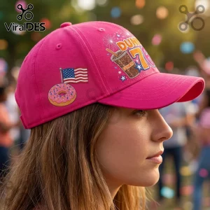 Dunkin Donuts 76th Anniversary Pink Baseball Cap featuring a coffee cup, a frosted donut, and an American flag icon.