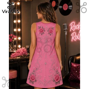 Back view of a woman wearing a pink sleeveless dress featuring printed pink roses and silver rhinestone-style filigree.!