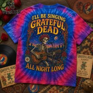 Grateful Dead All Night Long Tie Dye T-Shirt featuring a skeleton playing acoustic guitar on a blue and pink tie-dye fabric.
