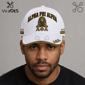 Alpha Phi Alpha Sphinx Premium White Baseball Cap featuring gold embroidery, black text, and Greek letters on a white base.
