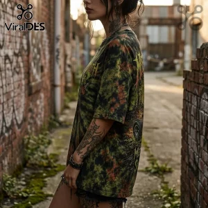 Person wearing a vintage-style green and black tie-dye metal graphic t-shirt in an outdoor urban alleyway setting.!