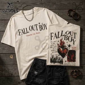 Cream colored cotton t-shirt with Fall Out Boy band graphic, burning heart illustration, and song lyrics on wooden floor.!